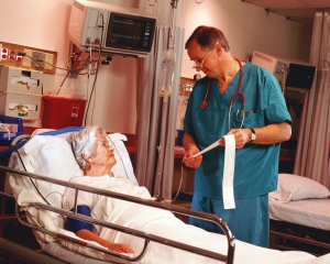 Doctor explaining patient on hospital bed